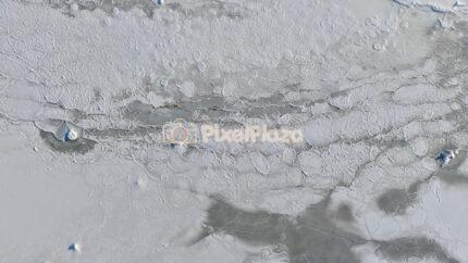 Aerial Top Down of Frozen Baltic Sea Ice Texture in Tallinn Winter