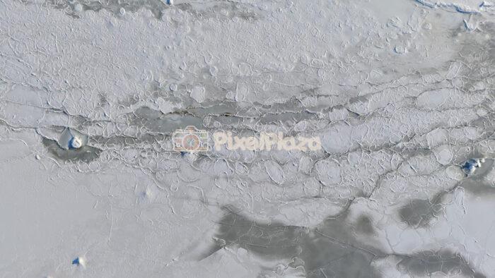 Aerial Top Down of Frozen Baltic Sea Ice Texture in Tallinn Winter