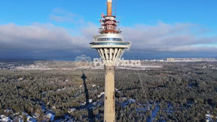 Tallinn TV Tower Aerial in Winter - Landmark Skyline and Forest Drone View, Estonia