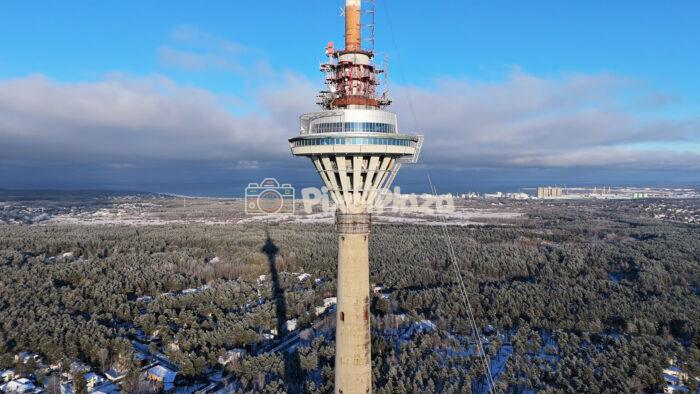 Tallinn TV Tower Aerial in Winter - Landmark Skyline and Forest Drone View, Estonia