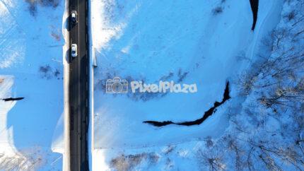 Top Down Winter Road and Frozen River in Pirita, Tallinn