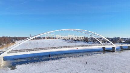 Winter Aerial View of the Pärnu Arch Bridge - Modern Landmark Over Frozen River