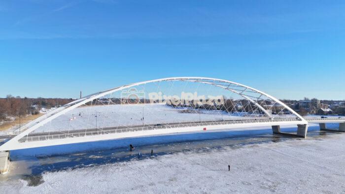 Winter Aerial View of the Pärnu Arch Bridge - Modern Landmark Over Frozen River