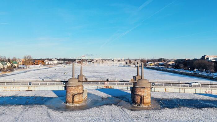 Winter Aerial of Pärnu City Center Bridge Over Frozen River, Estonia