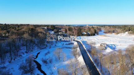 Winter Aerial of Pirita River and Snowy Landscape in Tallinn, Estonia