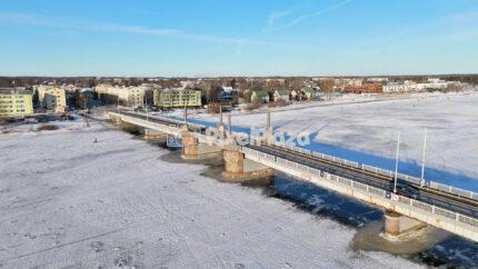 Winter Aerial of the Pärnu City Center Bridge - Frozen River Urban Landscape