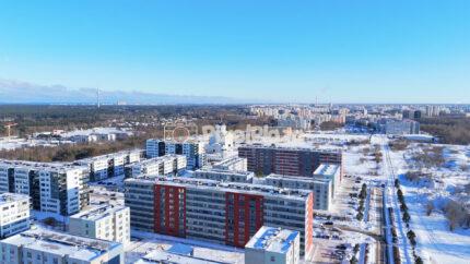 Winter Drone View of Lasnamäe Residential District, Tallinn Cityscape with Snowy Apartment Blocks