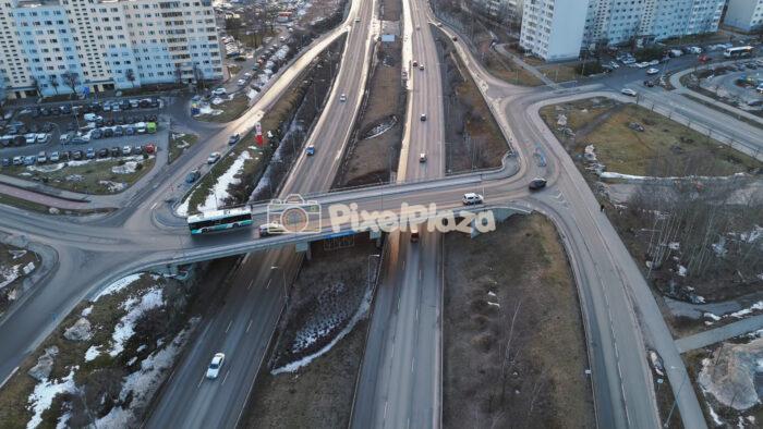 Aerial Drone View of Lasnamäe Highway Interchange and Urban Traffic in Tallinn, Estonia