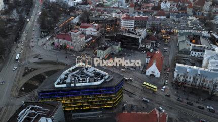 Aerial Drone View of Tallinn City Center at Dusk with Traffic and Historic Old Town