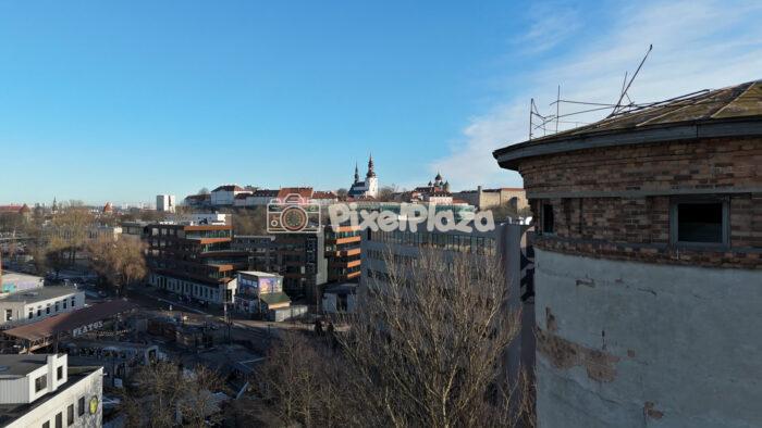 Aerial Drone View of Telliskivi Creative City and Tallinn Old Town Skyline, Estonia