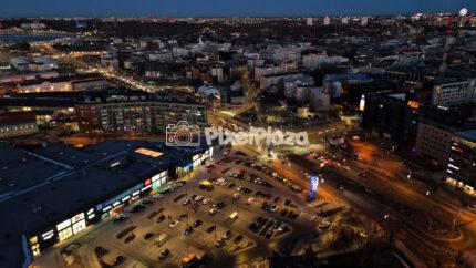 Aerial Night View of Busy City Intersection and Shopping Area in Tallinn, Estonia