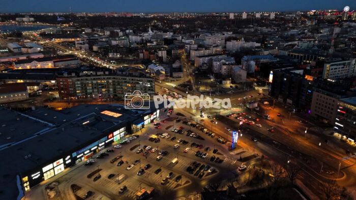 Aerial Night View of Busy City Intersection and Shopping Area in Tallinn, Estonia