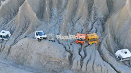 Drone View of Abandoned Trucks on Eroded Cliffs Rummu Quarry Estonia