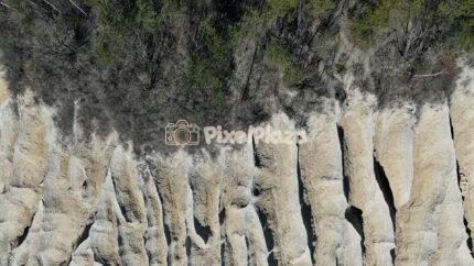 Drone View of Limestone Cliffs and Forest Edge at Rummu Quarry Estonia
