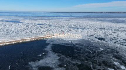 Frozen Baltic Sea and Breakwater at Paljassaare, Tallinn - Winter Drone Aerial
