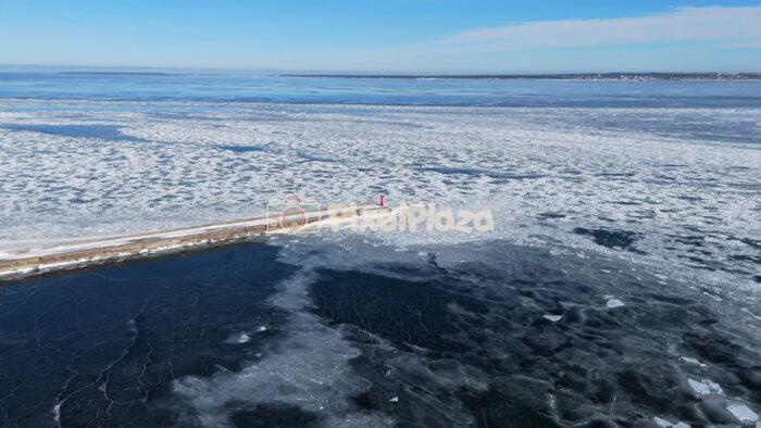 Frozen Baltic Sea and Breakwater at Paljassaare, Tallinn - Winter Drone Aerial