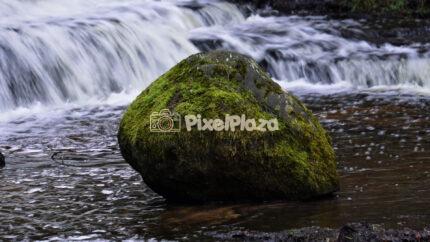Mossy Rock at Treppoja Waterfall Stream in Estonia Scenic Nature Flow