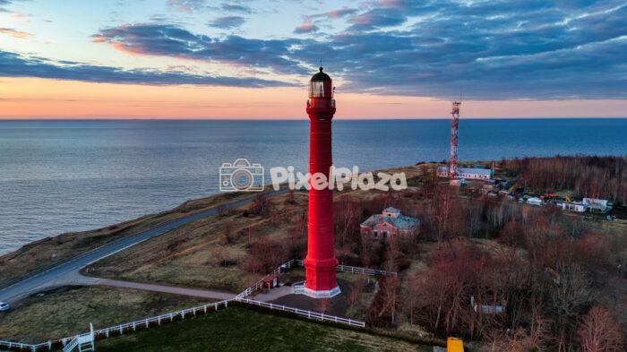 Aerial drone view of the Pakri red lighthouse at sunset in Estonia Aerial drone view of the Pakri red lighthouse at sunset in Estonia