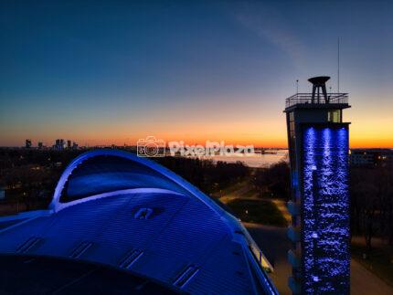 Drone view of Tallinn Song Festival Grounds at sunset with blue lighting