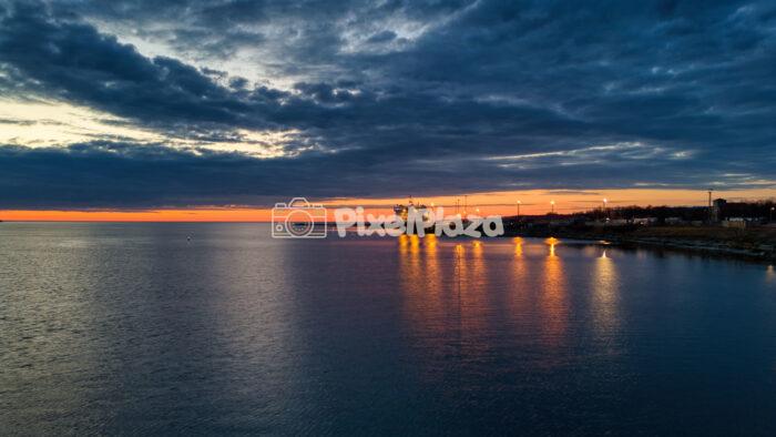 Sunset Drone View of Paldiski Port with Cargo Ferry and Harbor Lights Sunset Drone View of Paldiski Port with Cargo Ferry and Harbor Lights