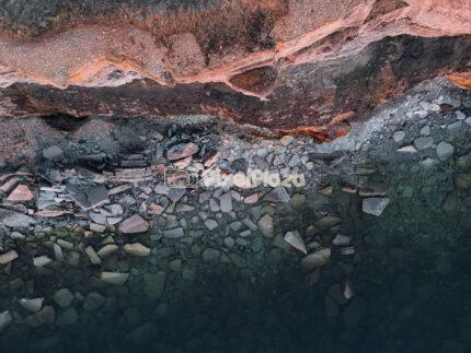 Top down drone view of Pakri limestone cliffs and rocky coast in Estonia