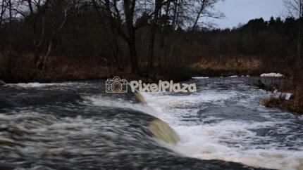 Vahiküla Waterfall Flowing River Rapids in Estonian Forest Nature