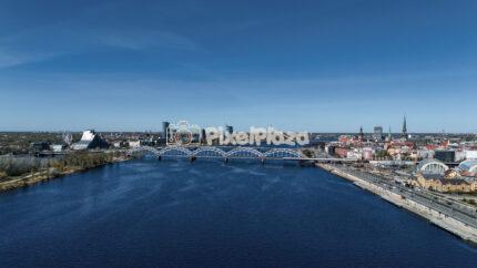 Aerial Riga Cityscape featuring Daugava River and Railway Bridge in Latvia