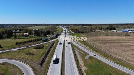 Aerial View of Highway Traffic Through Rural Landscape in Spring