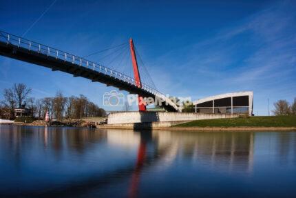 Modern Red Mitava Bridge and River Reflection in Jelgava Latvia
