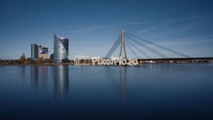 Modern Vansu Bridge and Swedbank Building with River Reflection in Riga