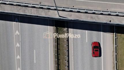 Top Down Drone View of Vehicles Driving on Modern Highway Road
