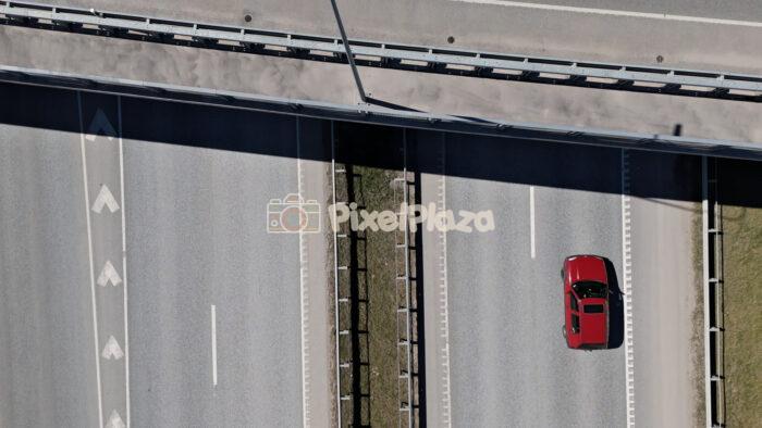 Top Down Drone View of Vehicles Driving on Modern Highway Road