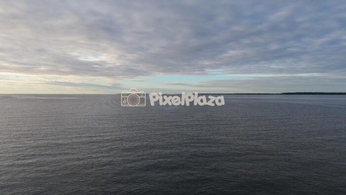 Dramatic Baltic Sea Horizon Under Cloudy Sky Aerial Drone View