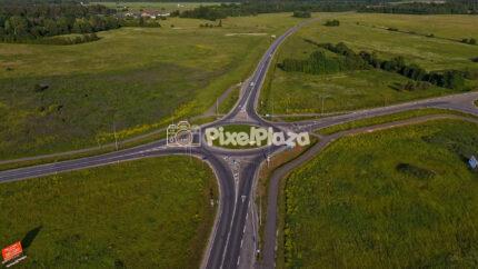 Summer Drone Hyperlapse Over Rural Roundabout and Country Roads in Estonia