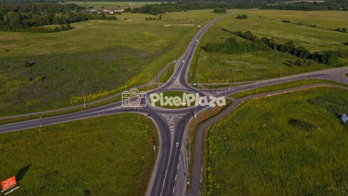Summer Drone Hyperlapse Over Rural Roundabout and Country Roads in Estonia