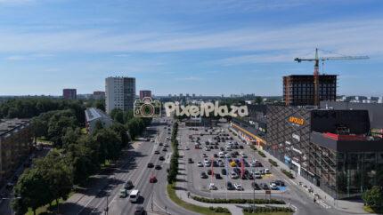4K drone video of Mustamäe Centrum mall and city traffic in Tallinn Estonia