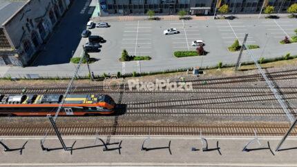 Aerial View of Electric Passenger Train on Tracks at Baltic Station