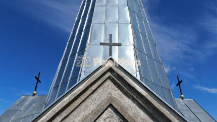Low Angle View of Church Spire with Crosses Against Blue Sky