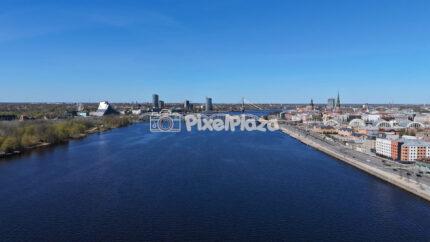 Riga Cityscape and Daugava River with Railway Bridge Latvia - 4k Drone Video