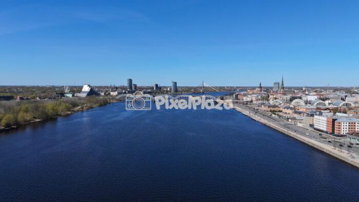Riga Cityscape and Daugava River with Railway Bridge Latvia - 4k Drone Video