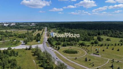 Aerial Drone Shot of Cars Driving Along Highway