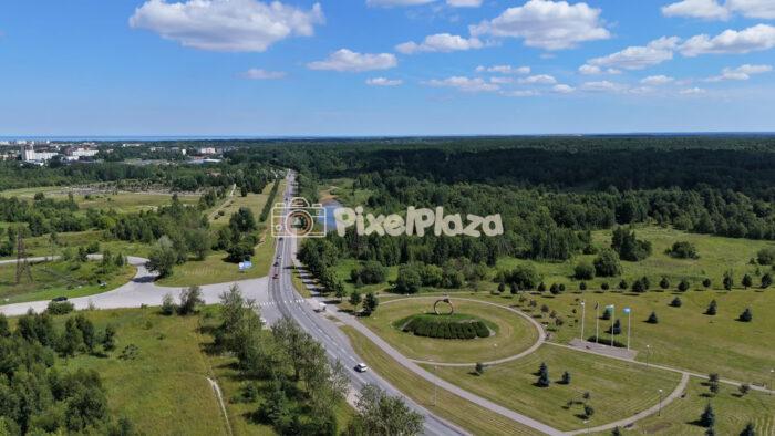 Aerial Drone Shot of Cars Driving Along Highway