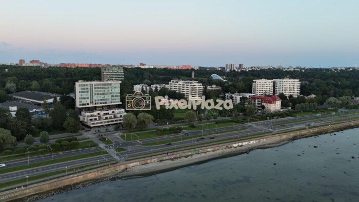 Aerial Panning Video Of Coastal City Highway At Dusk