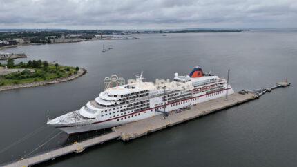 Aerial View of Large Cruise Ship Moored at Harbor Pier